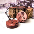 Cinnabar wood pendant struck by lightning